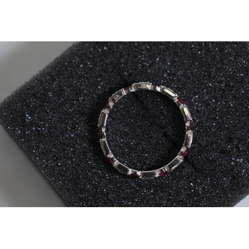 195 - Ruby and diamond full eternity ring set in 18ct white gold Size is between N and O