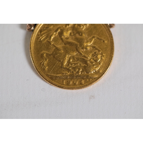 197 - A mounted gold sovereign, 1902. Plus a 9ct rose gold watch chain overall weight 25.19grams