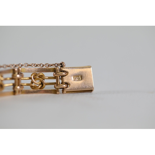 198 - A 15ct gold bracelet weighing 14.48 grams in excellent condition with safety chain.