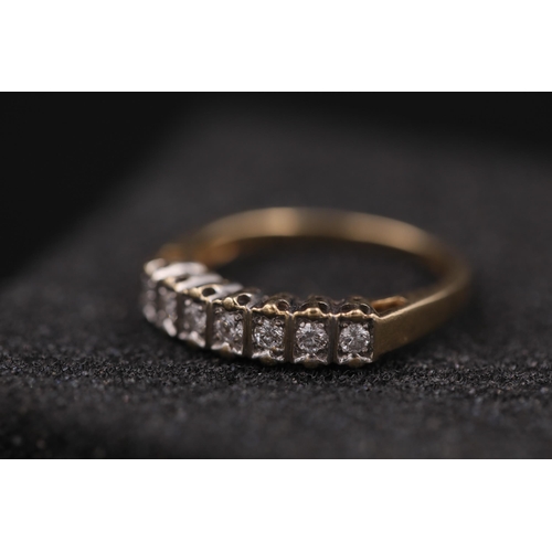 33 - 7 Stone diamond ring set in 9ct yellow gold Ring size is half way between N and O