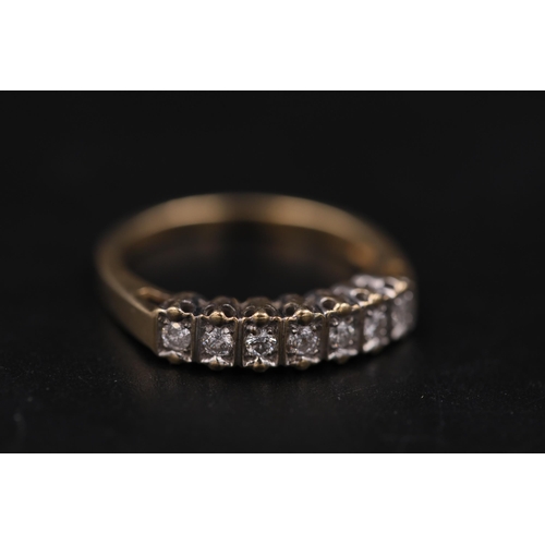 33 - 7 Stone diamond ring set in 9ct yellow gold Ring size is half way between N and O