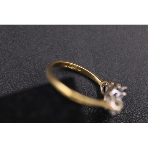 34 - Oval Sapphire and twin diamond ring set 18ct yellow gold Ring size is half way between N and O