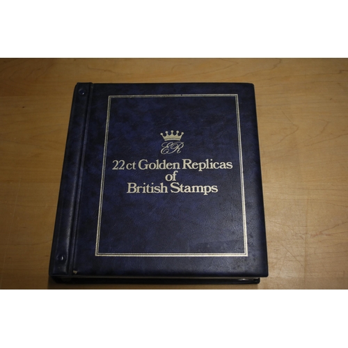 387 - A folder containing 22CT Golden Stamp Replicas