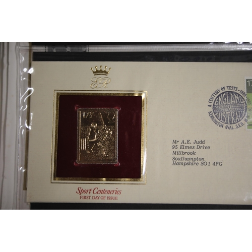 387 - A folder containing 22CT Golden Stamp Replicas