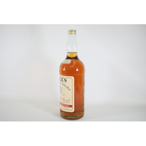 6 - A 4.5 Litre Bottle of Bells Blended Scotch Whiskey. These bottles are becoming quite rare and becomi... 