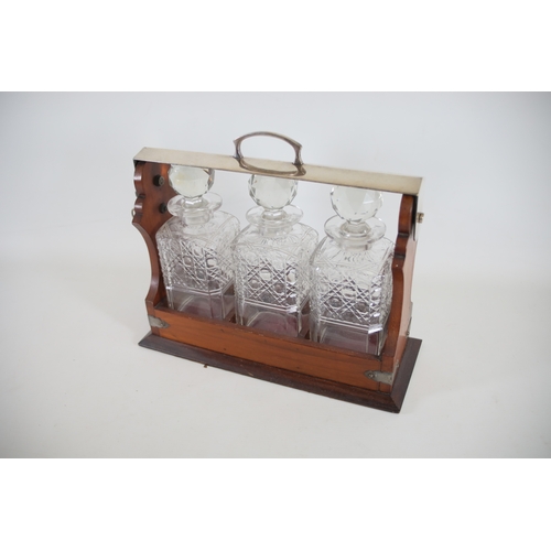 392 - Wooden Tantalus with 3 Decanters