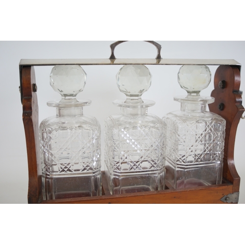 392 - Wooden Tantalus with 3 Decanters