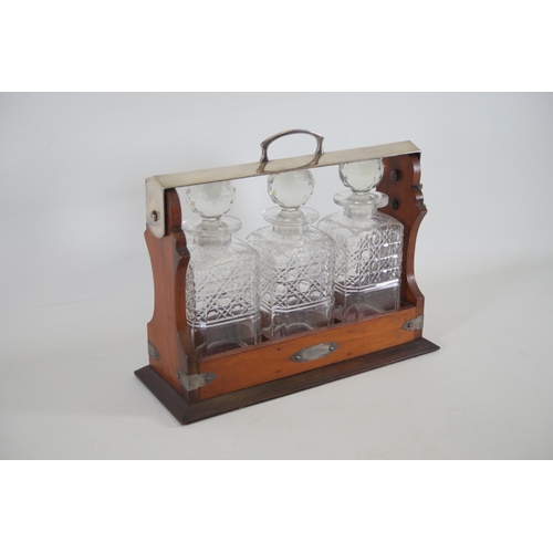 392 - Wooden Tantalus with 3 Decanters