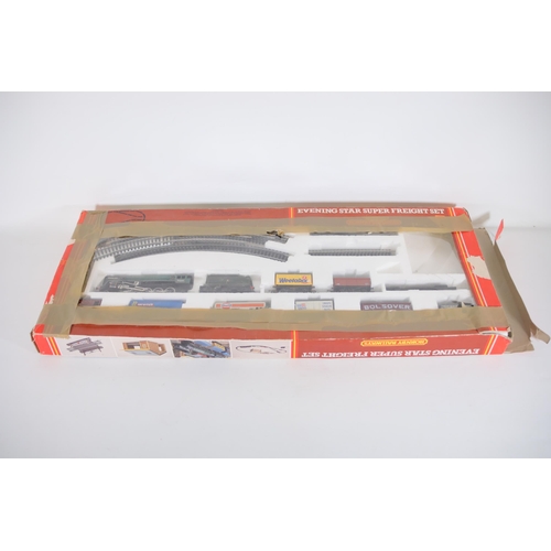 104 - Hornby Evening Star OO Gauge Locomotive, 8 goods wagons, track and points  loco shed and transformer... 