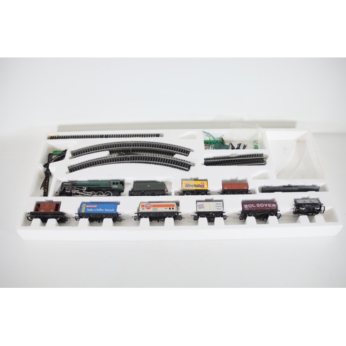 104 - Hornby Evening Star OO Gauge Locomotive, 8 goods wagons, track and points  loco shed and transformer... 