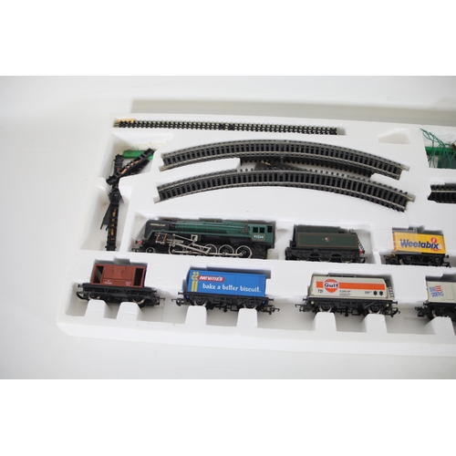 104 - Hornby Evening Star OO Gauge Locomotive, 8 goods wagons, track and points  loco shed and transformer... 