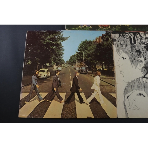 19 - A collection of Beatles Albums, Revolver shows some age related wear to the cover. PMC7009, on side ... 