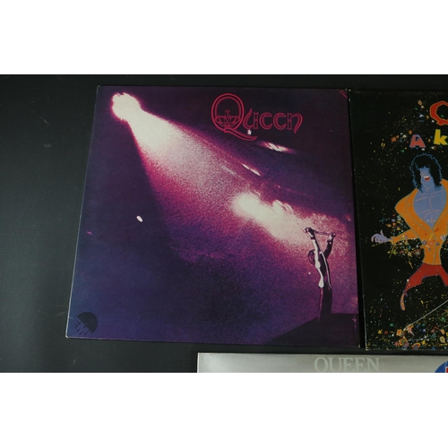 21 - A small collection of Queen Vinyl's, including 