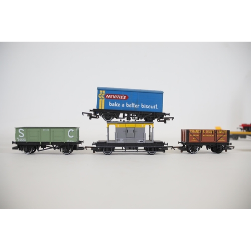 248 - Selection of OO gauge goods and minerals transportation vans and carriages. To include a Lima sea co... 