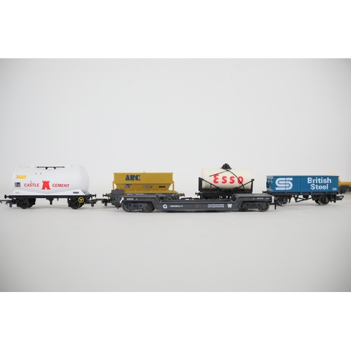 248 - Selection of OO gauge goods and minerals transportation vans and carriages. To include a Lima sea co... 