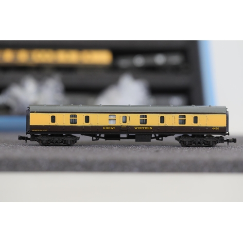 276 - N gauge coaches and goods transportation wagons in display case. 2 Lima coaches great western brown ... 