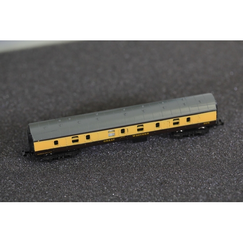 276 - N gauge coaches and goods transportation wagons in display case. 2 Lima coaches great western brown ... 