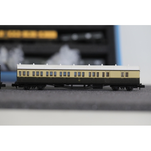 276 - N gauge coaches and goods transportation wagons in display case. 2 Lima coaches great western brown ... 