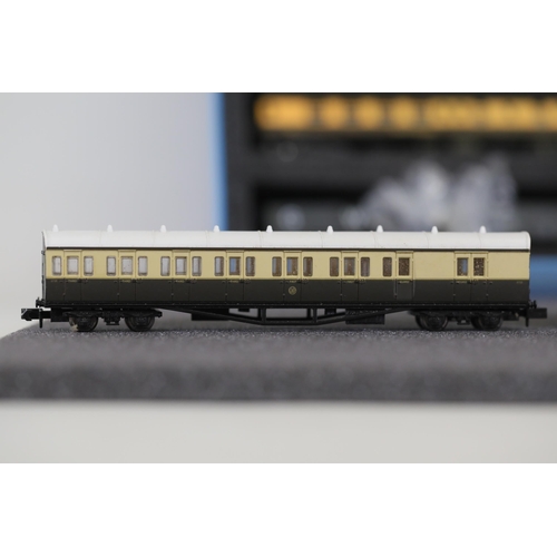 276 - N gauge coaches and goods transportation wagons in display case. 2 Lima coaches great western brown ... 