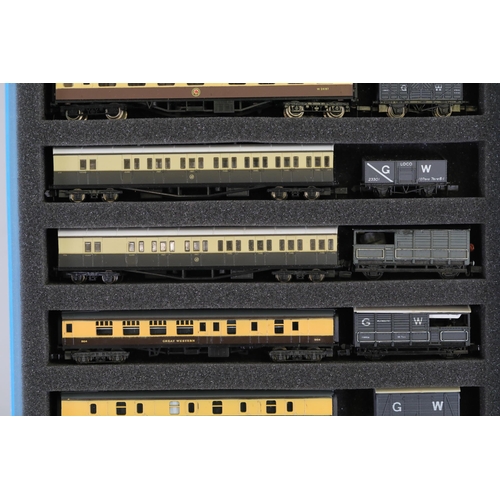 276 - N gauge coaches and goods transportation wagons in display case. 2 Lima coaches great western brown ... 