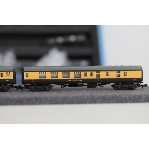 276 - N gauge coaches and goods transportation wagons in display case. 2 Lima coaches great western brown ... 