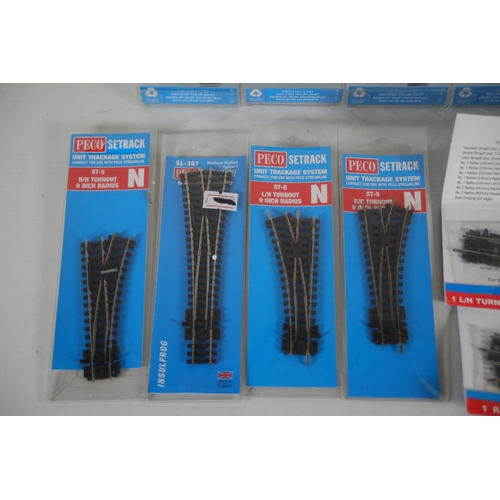 284 - Good selection of brand new and boxed Peco N gauge train track. 5x Peco setrack ST 3015 pack of 4 no... 