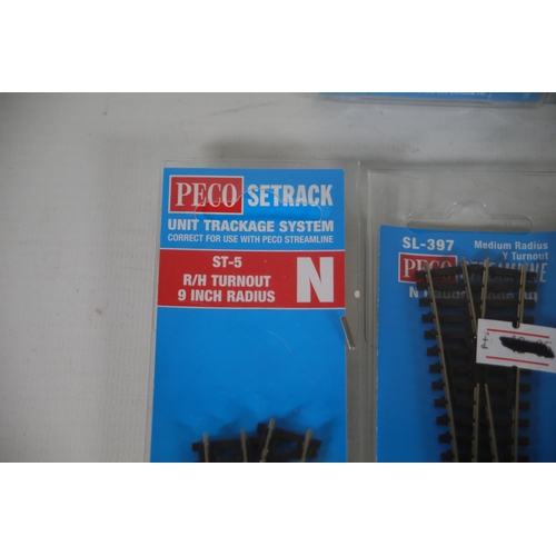 284 - Good selection of brand new and boxed Peco N gauge train track. 5x Peco setrack ST 3015 pack of 4 no... 