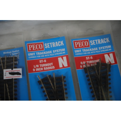 284 - Good selection of brand new and boxed Peco N gauge train track. 5x Peco setrack ST 3015 pack of 4 no... 