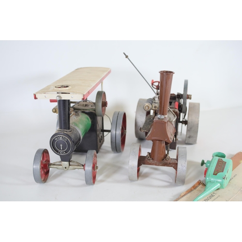 306 - 2 Mamod steam tractor engines brown and green with oil can and shoveler. The green Mamod needs a bit... 