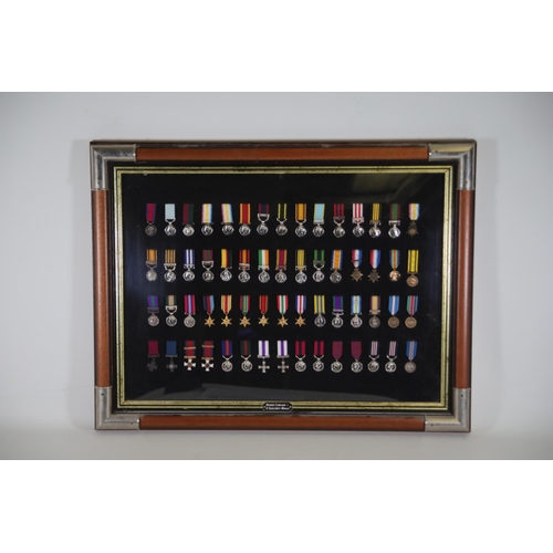 409 - A collection of framed British Campaign and Gallantry Medals, 65cm x 48cm, all in Mint Condition