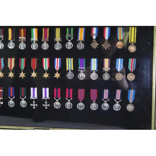 409 - A collection of framed British Campaign and Gallantry Medals, 65cm x 48cm, all in Mint Condition