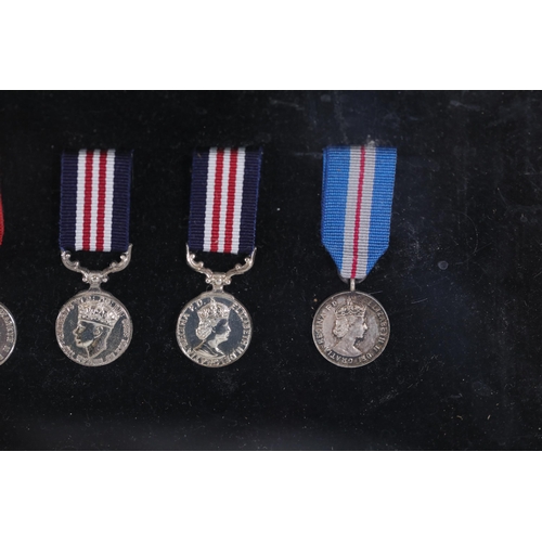 409 - A collection of framed British Campaign and Gallantry Medals, 65cm x 48cm, all in Mint Condition