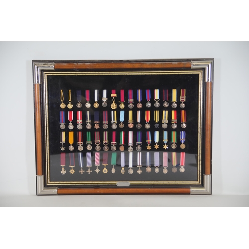 411 - A collection of framed British Campaign and Gallantry Medals in a Frame, 65cm x 48cm, all in Mint Co... 