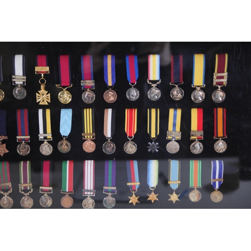 411 - A collection of framed British Campaign and Gallantry Medals in a Frame, 65cm x 48cm, all in Mint Co... 