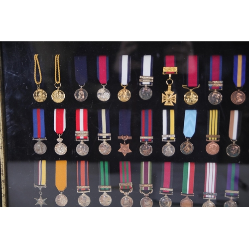 411 - A collection of framed British Campaign and Gallantry Medals in a Frame, 65cm x 48cm, all in Mint Co... 