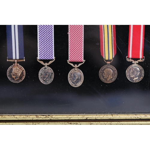 411 - A collection of framed British Campaign and Gallantry Medals in a Frame, 65cm x 48cm, all in Mint Co... 