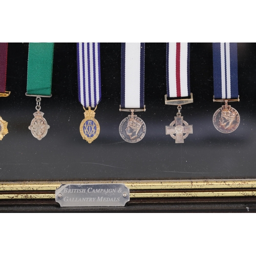 411 - A collection of framed British Campaign and Gallantry Medals in a Frame, 65cm x 48cm, all in Mint Co... 