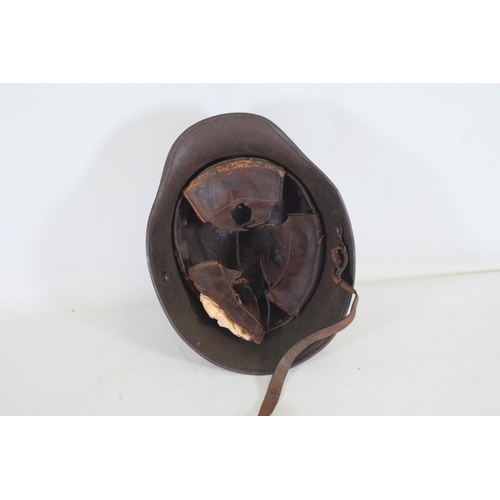 416 - World War 1 Stahlhelm M1916. As you look at the helmet on the inside right it has T666 stamped into ... 