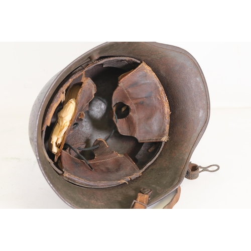 416 - World War 1 Stahlhelm M1916. As you look at the helmet on the inside right it has T666 stamped into ... 