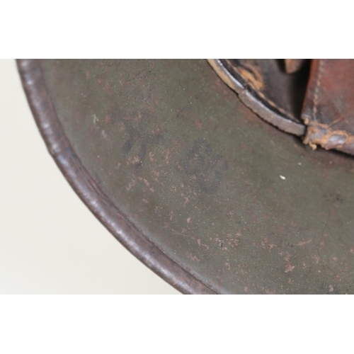 416 - World War 1 Stahlhelm M1916. As you look at the helmet on the inside right it has T666 stamped into ... 