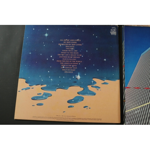 42 - A collection of Four vinyl albums, including Yes, Electric Light Orchestra and Gerry Rafferty. Gerry... 