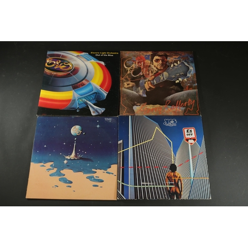 42 - A collection of Four vinyl albums, including Yes, Electric Light Orchestra and Gerry Rafferty. Gerry... 