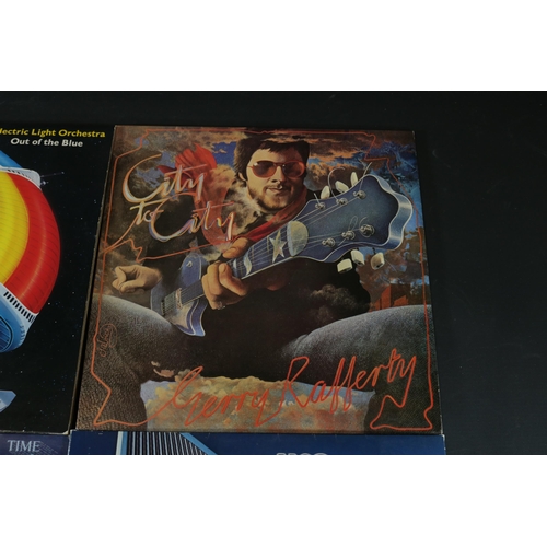 42 - A collection of Four vinyl albums, including Yes, Electric Light Orchestra and Gerry Rafferty. Gerry... 