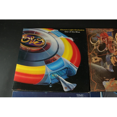 42 - A collection of Four vinyl albums, including Yes, Electric Light Orchestra and Gerry Rafferty. Gerry... 