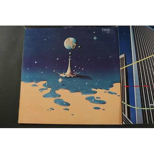 42 - A collection of Four vinyl albums, including Yes, Electric Light Orchestra and Gerry Rafferty. Gerry... 