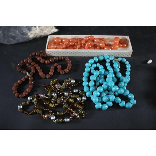 713 - Large collection of costume jewellery including millefiori beads, butterscotch amber style pearls, a... 