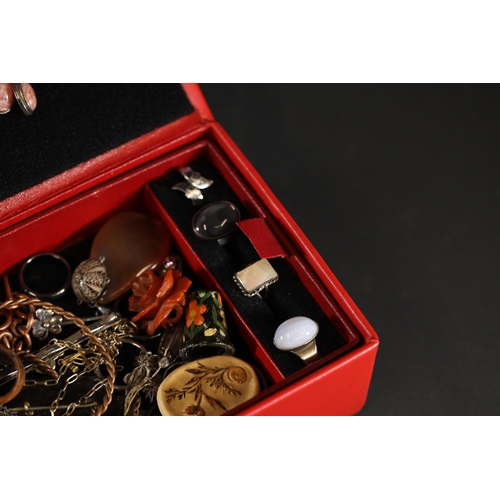 714 - A beautiful basket of vintage costume jewellery, in a red container. Includes rings, earrings and ne... 