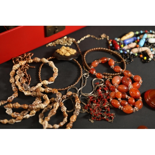 714 - A beautiful basket of vintage costume jewellery, in a red container. Includes rings, earrings and ne... 