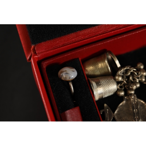 714 - A beautiful basket of vintage costume jewellery, in a red container. Includes rings, earrings and ne... 