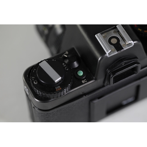 18 - Rolleiflex SL35 E Black with Rollei-HFT Planar 1.8/50mm Lens

The camera features a clear viewfinder... 